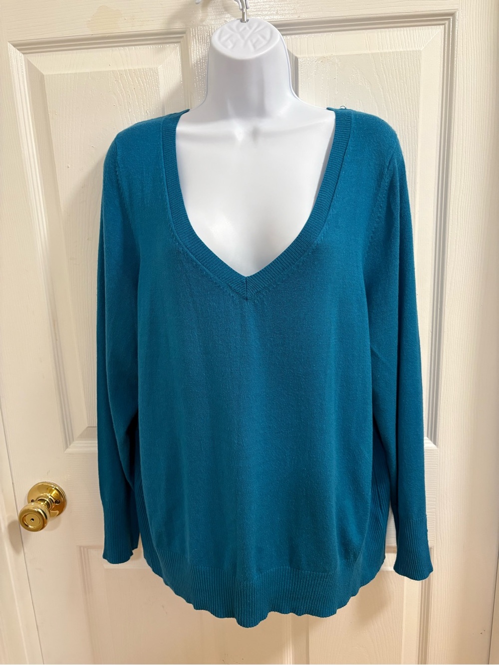 Lane Bryant teal V-neck sweater featuring a relaxed knit